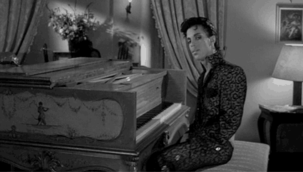 Prince-Stops-Playing-The-Piano-In-Black-White-Gif